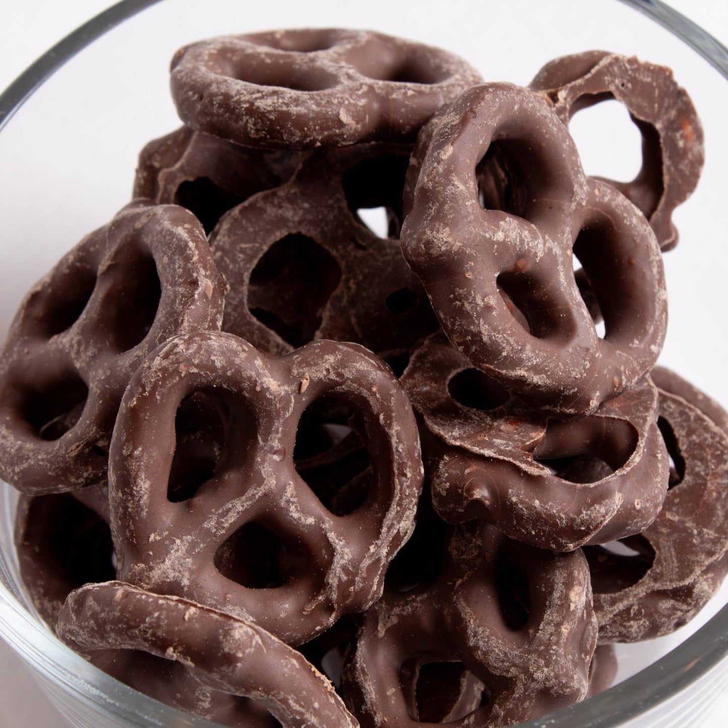 Handcrafted mini pretzels coated in smooth dark chocolate, made in USA, a delicious snack from Kitchen & Food, Snacks and Sweets, Candy, USA Made, Best Sellers, and Promo Eligible collections.