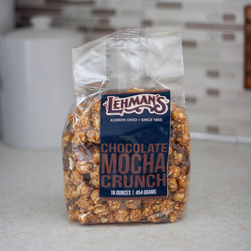 Clear bag of handcrafted Lehman's caramel popcorn with rich chocolate mocha crunch pieces, a unique sweet and crunchy snack made in USA, perfect for Kitchen & Food, Snacks and Sweets, Popcorn, USA Made, and Best Sellers collections.