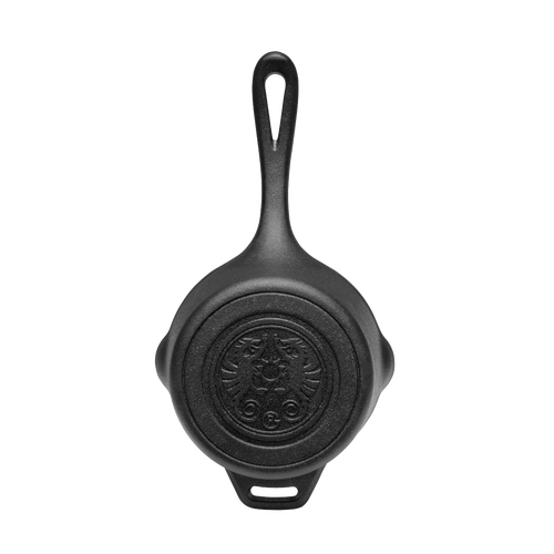 Heavy-duty cast iron saucepan with lid and embossed self-basting design on bottom, featuring an extended handle, perfect for camping, farm, garden, and outdoor cookware collections.