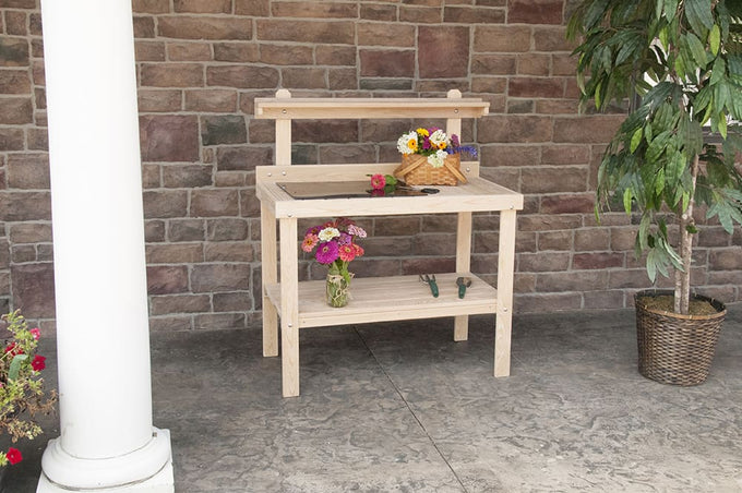 Handcrafted classic garden table made in USA by Amish craftsmen, constructed from unfinished cypress with raised back shelf and lower slatted shelf, ideal for outdoor gardening tasks.