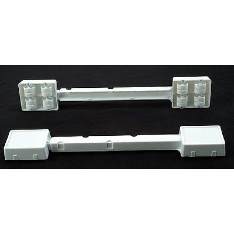 Set of adjustable white plastic appliance rollers designed to raise and easily move heavy household appliances, ideal for use in home & decor, stoves, and refrigerators collections.