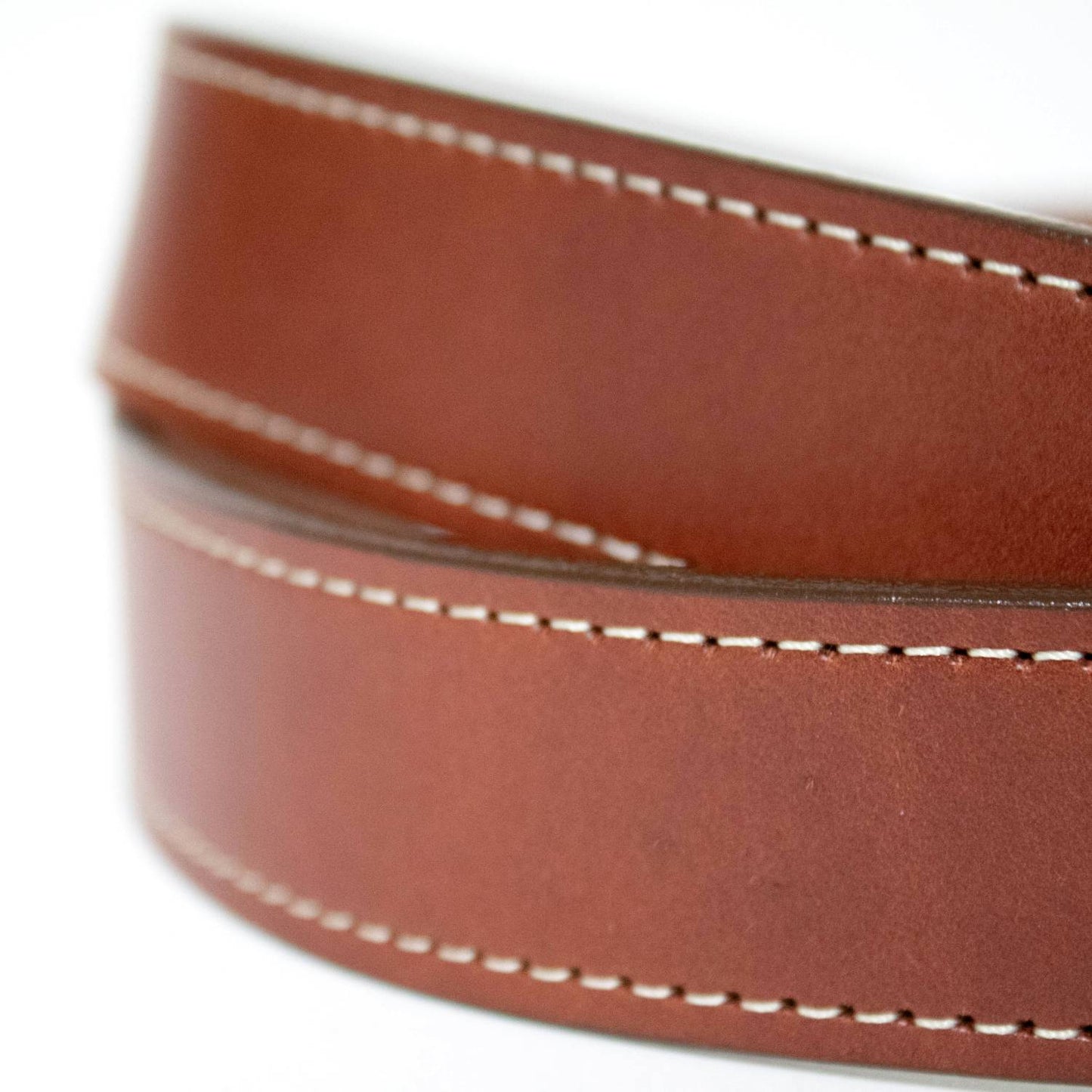 Close-up of a handcrafted Amish-made brown genuine leather belt with fine white stitching, part of USA Made, Clothing and Accessories, Best Sellers, and Promo Eligible collections.