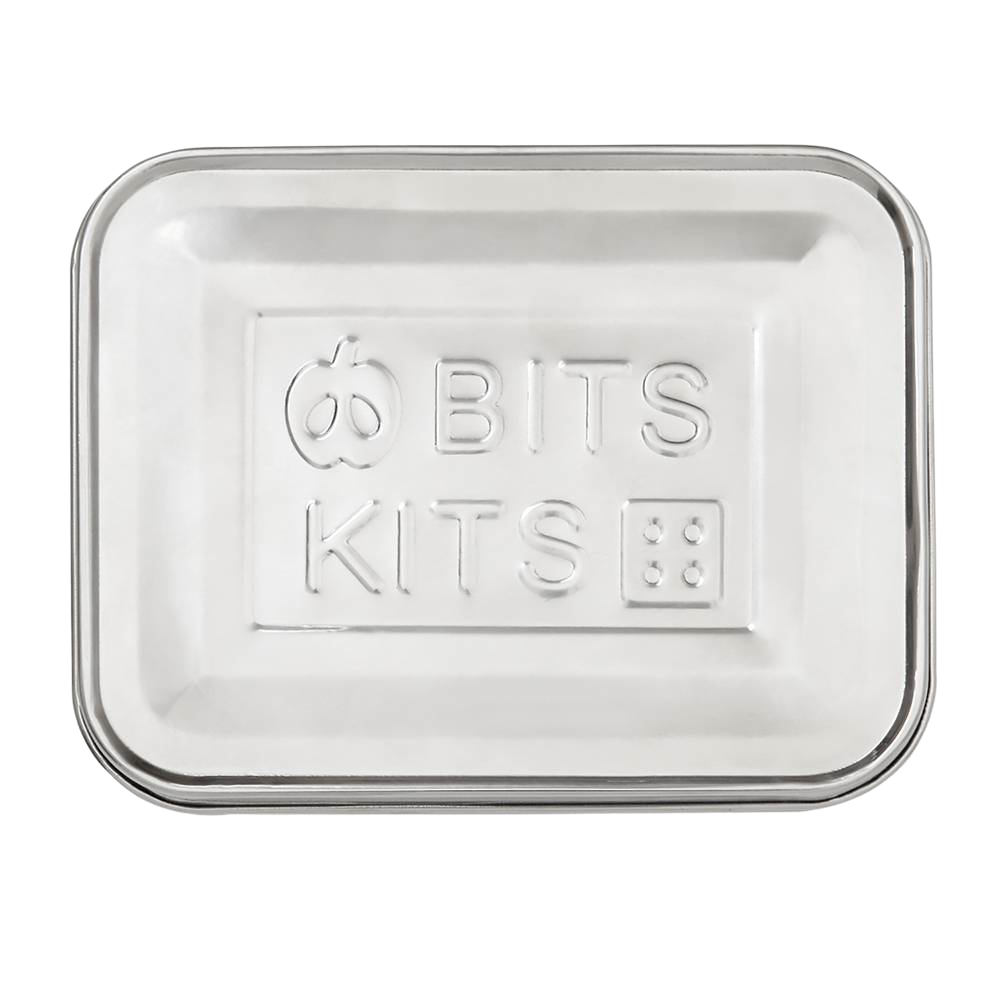 Rectangular stainless steel snack container lid embossed with playful apple and dice designs, suitable for Kitchen & Food, Storage and Serving, Best Sellers, and Promo Eligible collections.