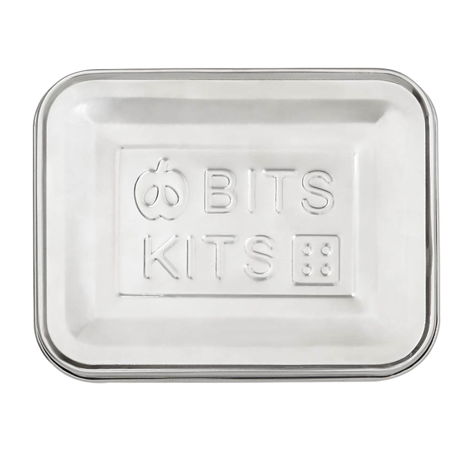 Rectangular stainless steel snack container lid embossed with playful apple and dice designs, suitable for Kitchen & Food, Storage and Serving, Best Sellers, and Promo Eligible collections.
