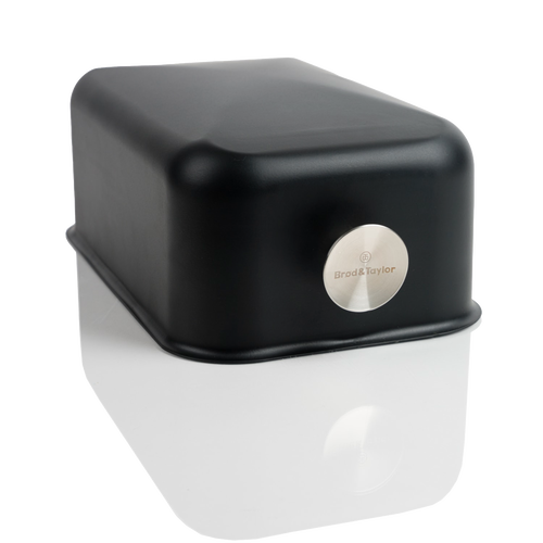 Lightweight black baking shell with smooth rounded edges and a silver logo medallion, designed for crusty bread baking on any flat surface, featured in Kitchen & Food and Baking Supplies collections.
