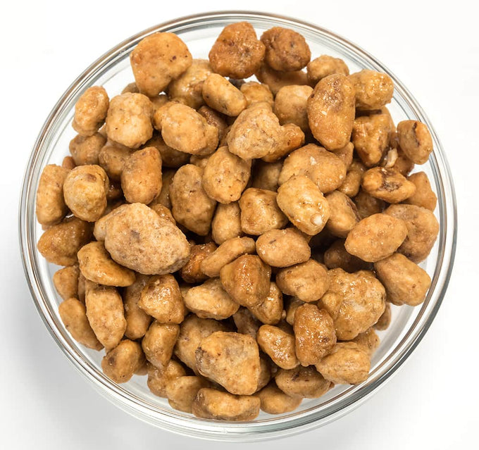 Clear glass bowl filled with handcrafted caramelized black walnuts coated in a sweet buttery glaze, featured in Kitchen & Food, Snacks and Sweets, Pantry, and USA Made collections.