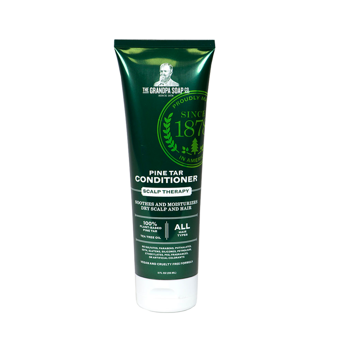 Dark green tube of handcrafted conditioner for scalp therapy, made in USA with plant-based pine tar and tea tree oil, featured in Health & Wellness and Best Sellers collections.