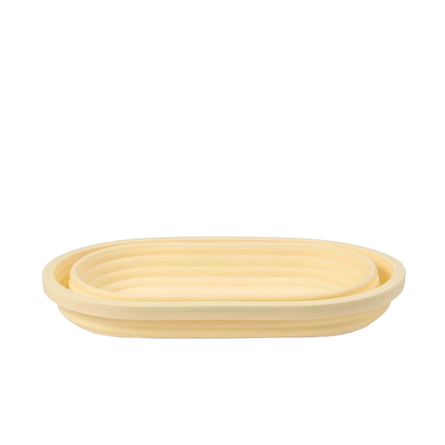 Light beige collapsible bread proofing basket with concentric ridges, crafted from durable silicone and steel rim for shaping dough and convenient storage in Kitchen & Food and Baking Supplies collections.