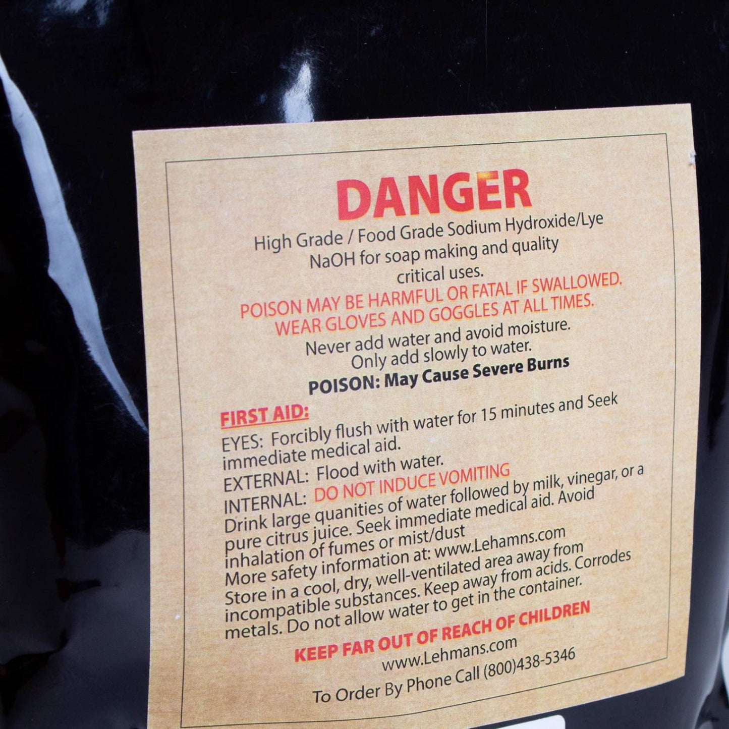 Warning label on a resealable bag of high-grade food grade sodium hydroxide lye beads detailing safety precautions, first aid instructions, and handling warnings for soapmaking in Health & Wellness and Soapmaking Supplies collections.