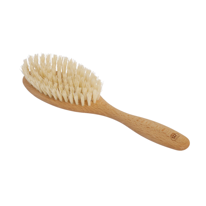 Handcrafted beechwood hairbrush with seven rows of natural Tampico bristles, designed for gentle scalp stimulation, featured in Health & Wellness and Grooming collections.