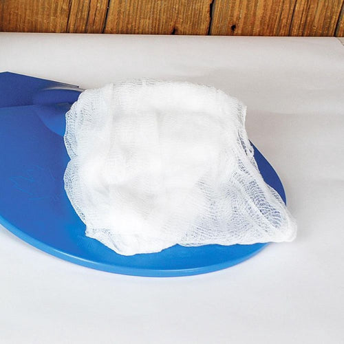 White cheesecloth folded on a blue plastic surface, part of maple syrup sugaring supplies for farm, garden, and orchard use in maple sap collection kits.