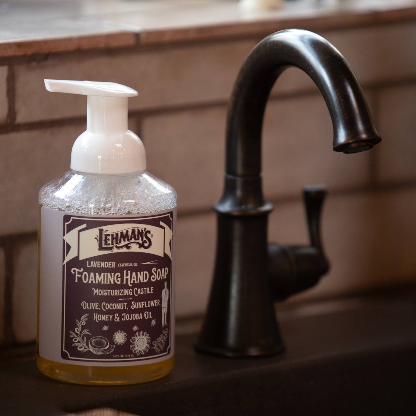 Clear pump bottle of Lehman's handcrafted moisturizing foaming hand soap with lavender scent, made in USA with natural oils including olive, coconut, sunflower, honey, and jojoba, suitable for Health & Wellness, Grooming and Personal Hygiene, Soaps and Soapmaking collections.