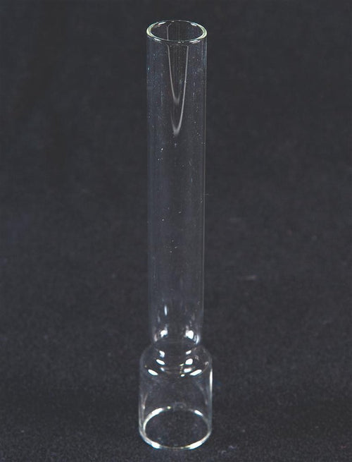 Clear glass chimney with cylindrical shape and rounded base, designed as a replacement part for oil lamps, featured in Lamps & Lighting and Chimneys and Globes collections.