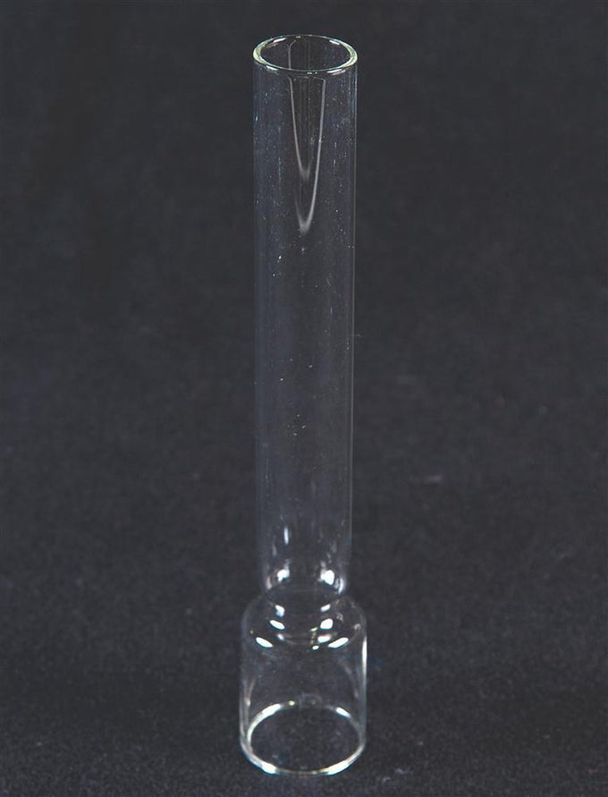 Clear glass chimney with cylindrical shape and rounded base, designed as a replacement part for oil lamps, featured in Lamps & Lighting and Chimneys and Globes collections.