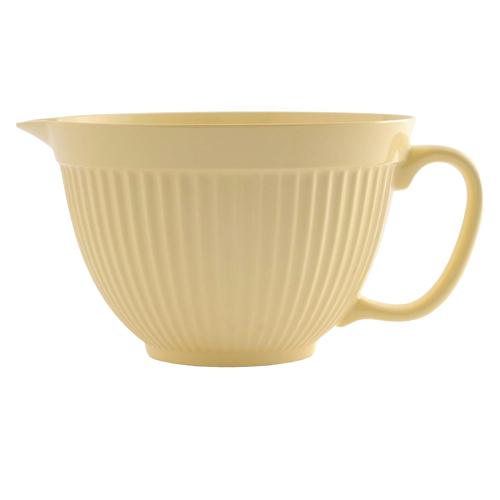 Soft yellow melamine mixing bowl with built-in handle and spout, featuring a textured exterior and non-slip base, crafted for easy pouring in Kitchen & Food and Baking Supplies.