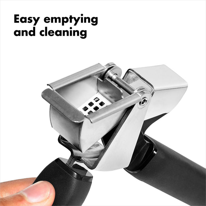 Stainless steel garlic press with a large crushing chamber and soft black handles, shown with easy-to-empty hopper feature for quick cleaning, ideal for Kitchen & Food and Kitchen Gadgets.