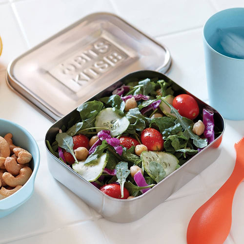 Square stainless steel reusable container filled with fresh mixed salad greens, cherry tomatoes, cucumber slices, and chickpeas, ideal for zero-waste lunch packing in Kitchen & Food and Storage collections.