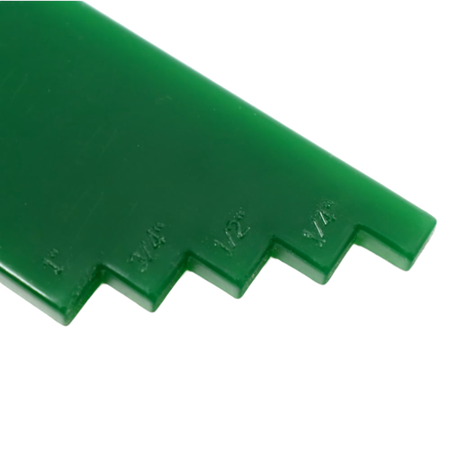 Close-up of a green handcrafted plastic lid lifter with measurement notches, designed for use in Kitchen & Food, Food Preservation, and Canning collections.