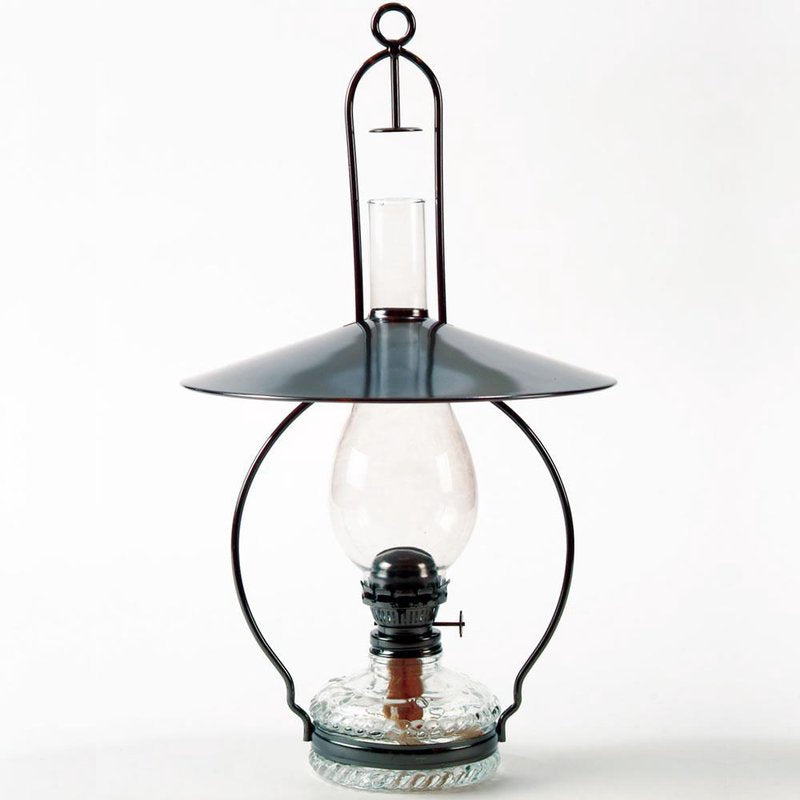 Handcrafted hanging oil lamp with antiqued steel frame, top reflector directing light downward, clear glass chimney, and decorative embossed base, ideal for farm, garden, and homesteading.