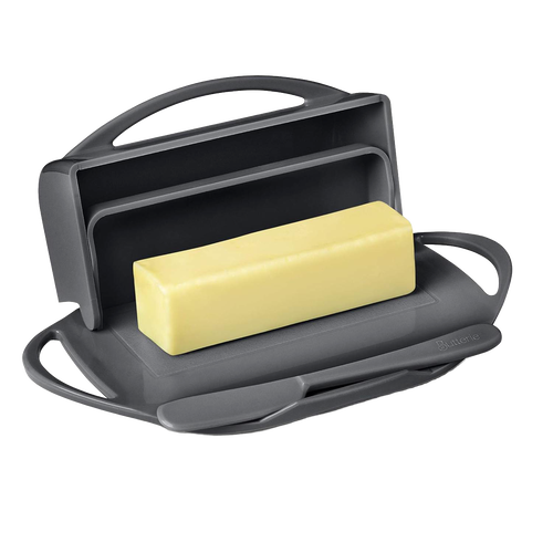 Dark gray flip-top butter dish holding a block of butter with a matching spreader in the cradle, designed for tidy storage and easy spreading in kitchen gadgets and accessories collections.