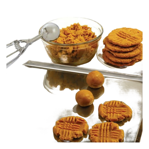Metal scoop with spring handle next to clear glass bowl filled with cookie dough and a stack of freshly pressed peanut butter cookies on a reflective surface, handcrafted for Kitchen & Food, Cookware, Baking Supplies, and Best Sellers collections.