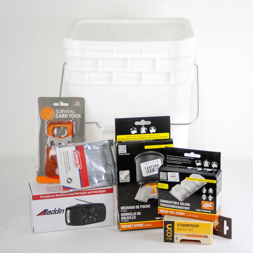 White plastic bucket filled with handcrafted survival tools including a compact emergency radio flashlight, pocket stove, solid fuel cubes, match kit, and survival card, ideal for Farm, Garden & Tool, Camping, Emergency Supplies, and Best Sellers collections.