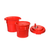 Red plastic hand-powered spinning clothes wringer with removable basket and lid featuring a manual crank, designed for efficient laundry drying and included in Home & Decor and Laundry Supplies collections.