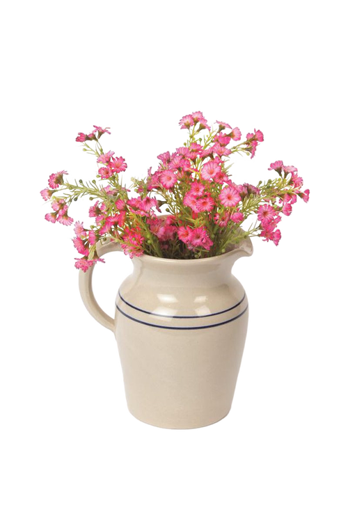 Handcrafted cream stoneware pitcher with two blue stripes, filled with vibrant pink flowers, made in USA, ideal for Kitchen & Food, Dinnerware, Holiday Hosting, Storage and Serving collections.