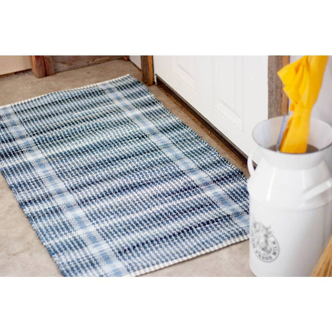 Handwoven denim rug in blue plaid pattern, featuring durable fabric made from recycled jeans, handcrafted by Amish volunteers, ideal for Home & Decor and USA Made collections.