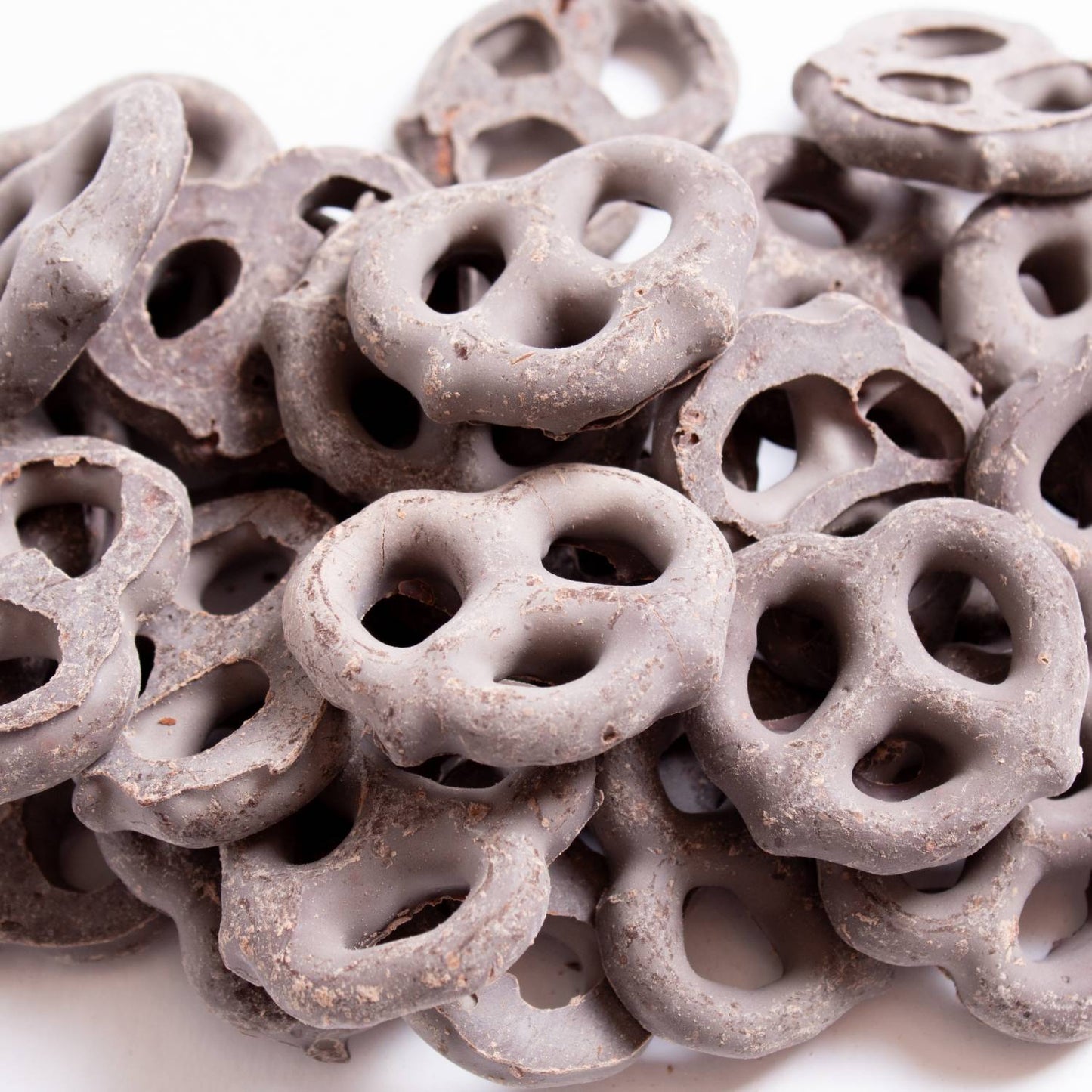 Close-up of handcrafted Amish made mini pretzels coated in rich dark chocolate, a USA made snack perfect for Kitchen & Food, Snacks and Sweets, Candy, Best Sellers, and Promo Eligible collections.