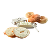 Polished stainless steel butter dish with matching cover, holding a block of cream cheese topped with herbs, styled with bagels and a bread slice spread with cream cheese, ideal for Kitchen & Food and Specialty Equipment collections.
