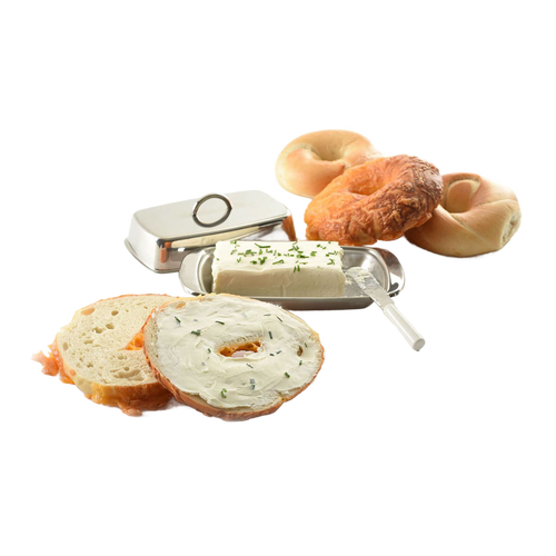 Polished stainless steel butter dish with matching cover, holding a block of cream cheese topped with herbs, styled with bagels and a bread slice spread with cream cheese, ideal for Kitchen & Food and Specialty Equipment collections.