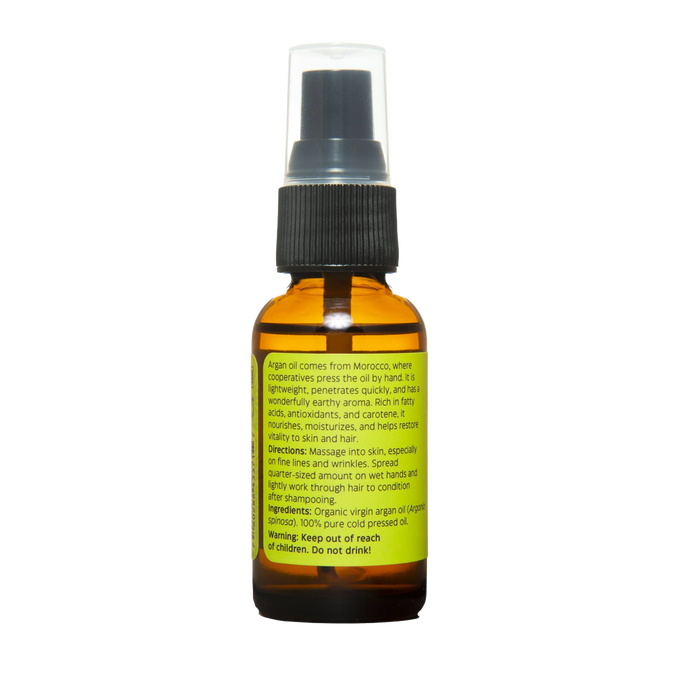 Amber glass bottle of handcrafted argan oil with black pump top and clear cap, made in USA and featured in Health & Wellness and Grooming collections