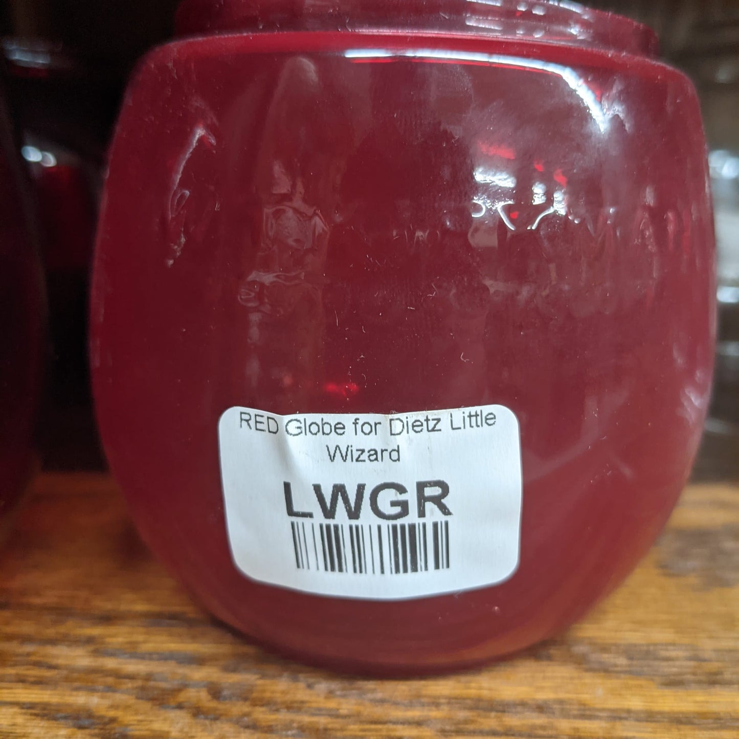Handcrafted red replacement globe designed for Dietz Lil' Wizard oil lanterns, suitable for camping, emergency supplies, and outdoor lighting in lamps and lighting collections.