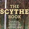 Close-up of the cover of The Scythe Book featuring a tall, handcrafted scythe handle with blade against a backdrop of standing grass, ideal for farm, garden & tool, lawncare, and home and garden how-to books collections.