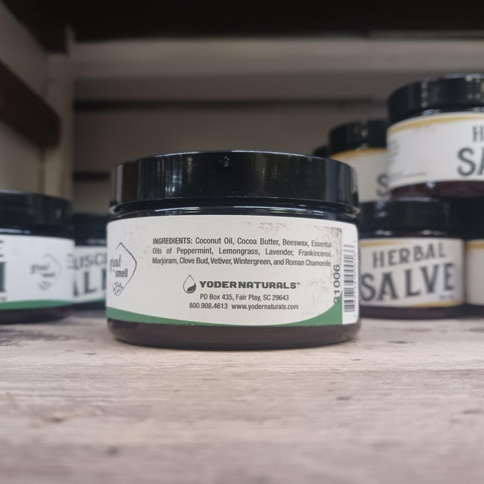 Small black jar of natural muscle balm with a white label listing coconut oil, cocoa butter, beeswax, and essential oils, part of Health & Wellness, Balms, Creams and Lotions, USA Made, and Best Sellers collections.