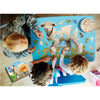 Children and an adult working together on a handcrafted lamb-shaped puzzle with large pieces, featuring playful farm scenery, popcorn nearby, promoting Toys, Books & Games collections.