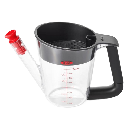 Clear plastic fat separator with black cushioned handle and red stopper, featuring measurement markings and strainer inside, perfect for Kitchen & Food and Cooking and Baking Helpers collections.