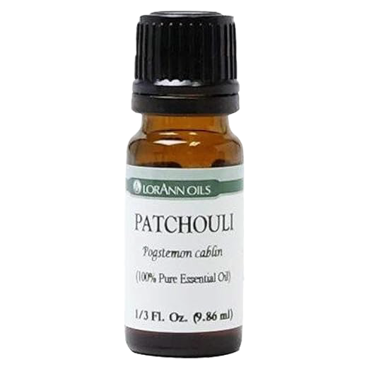 Small amber glass bottle with black cap containing pure Patchouli essential oil, ideal for Health & Wellness, aromatherapy, soapmaking, and crafting uses.