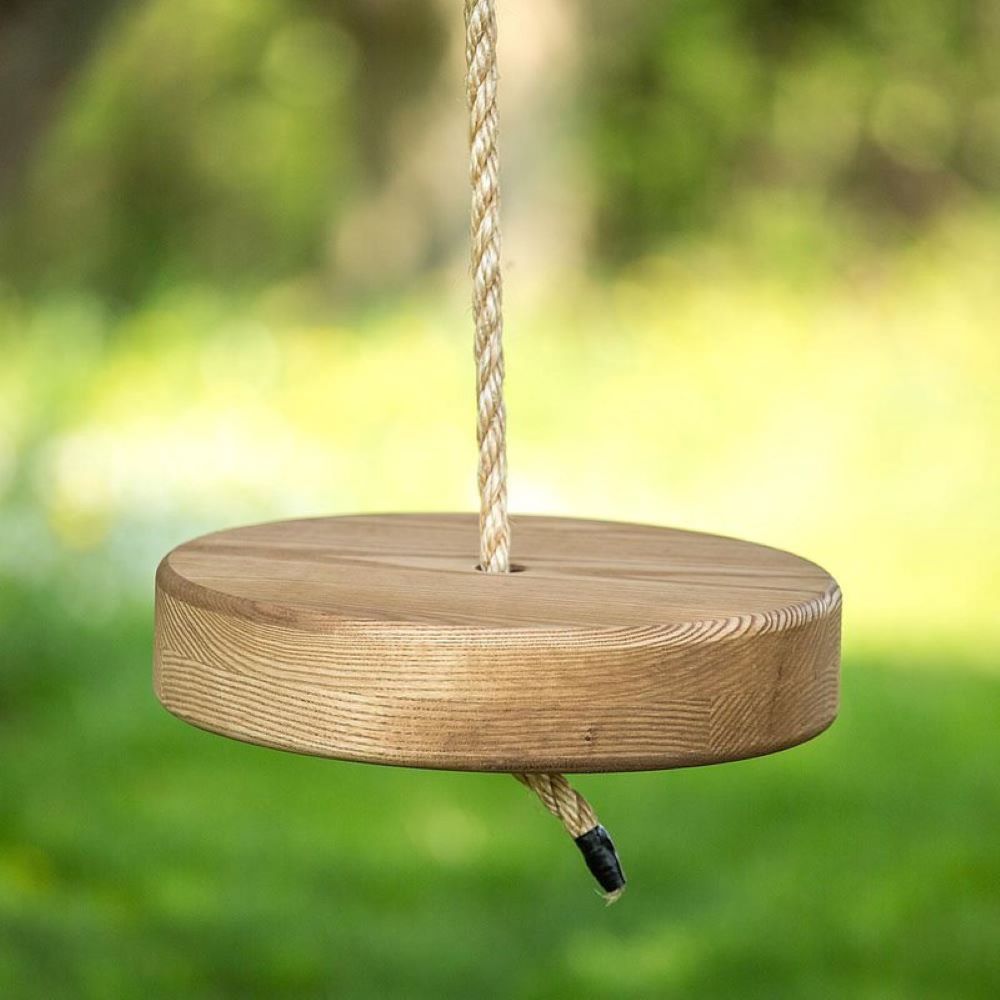 Handcrafted round wooden tree swing with durable rope hanging outdoors, part of Toys, Books & Games, USA Made, Children’s Toys, and Outdoor Play collections.