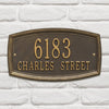 Custom bronze metal wall plaque with raised numbers and street name on a textured background, designed to enhance curb appeal, part of Home & Decor, USA Made, and Best Sellers collections.