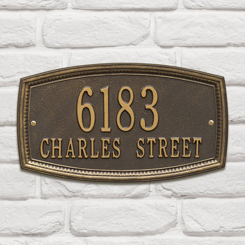 Custom bronze metal wall plaque with raised numbers and street name on a textured background, designed to enhance curb appeal, part of Home & Decor, USA Made, and Best Sellers collections.
