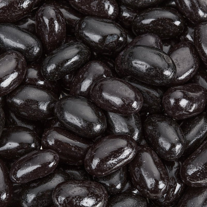 Close-up of shiny, jumbo-sized black licorice jelly beans clustered together, a popular candy featured in Kitchen & Food, Snacks and Sweets, Best Sellers, and Promo Eligible collections.