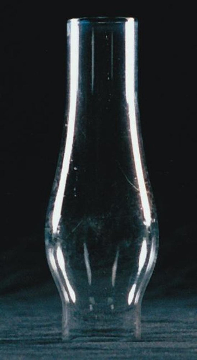 Handcrafted clear glass oil lamp chimney with a gently curved shape, designed for lamps and lighting, parts and accessories, chimneys and globes, and best sellers collections.