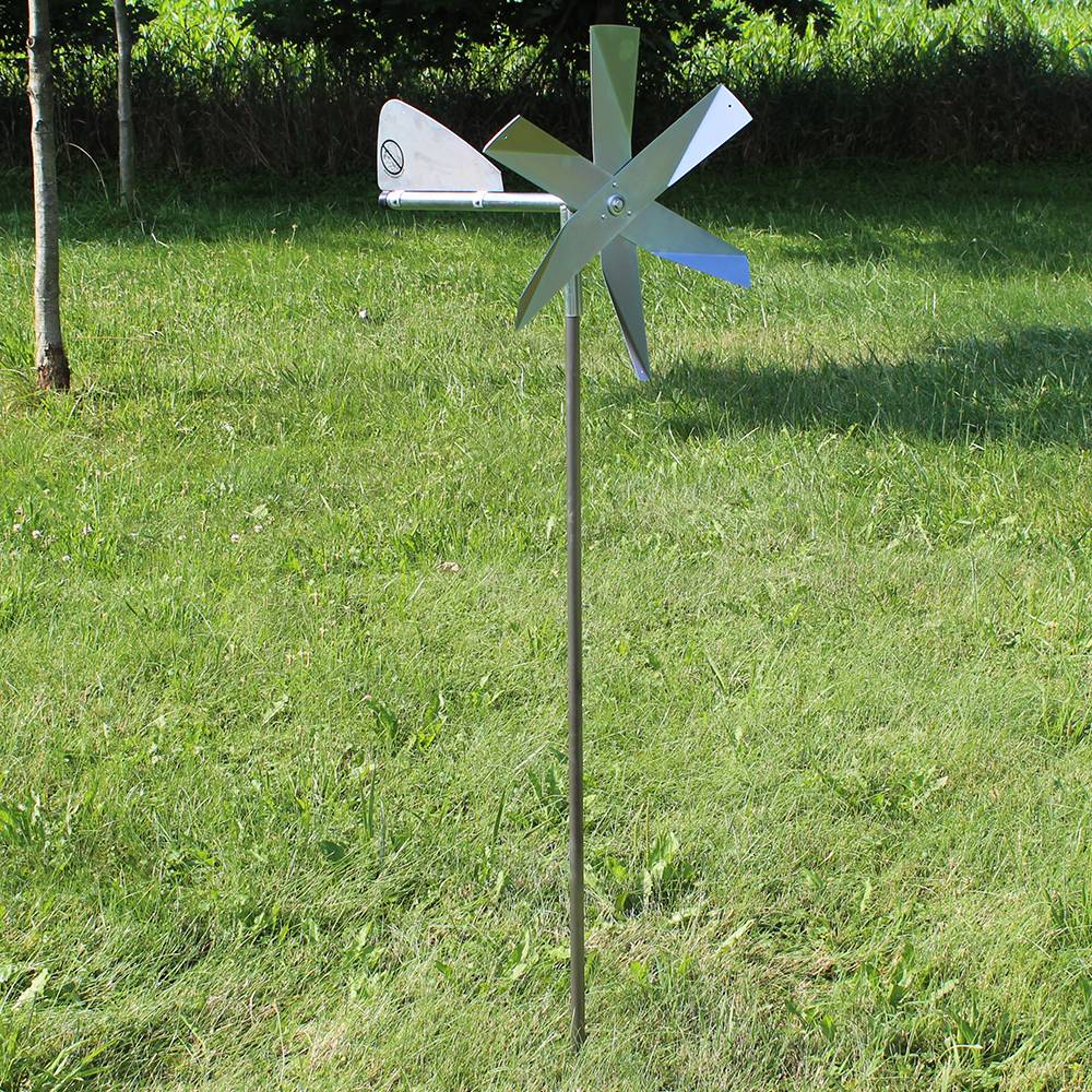 Handcrafted metal windmill with polished blades mounted on a slender rod, designed for humane mole deterrence in farm, garden, lawncare, pest control, and best sellers collections.