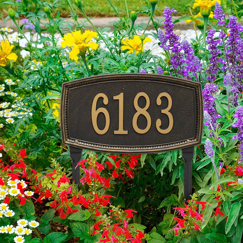 Elegant black custom lawn plaque with gold numbers, handcrafted in the USA, set amid colorful flowers, ideal for Home & Decor, Mailboxes and Address Signs collections.
