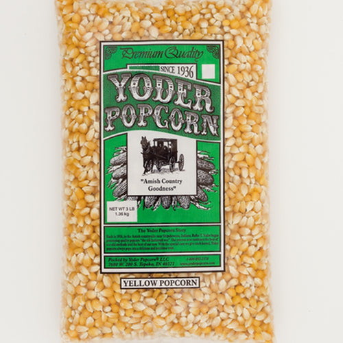 Clear plastic bag filled with traditional large yellow popcorn kernels labeled as Amish country handcrafted and made in USA, suitable for Kitchen & Food and Snacks collections.
