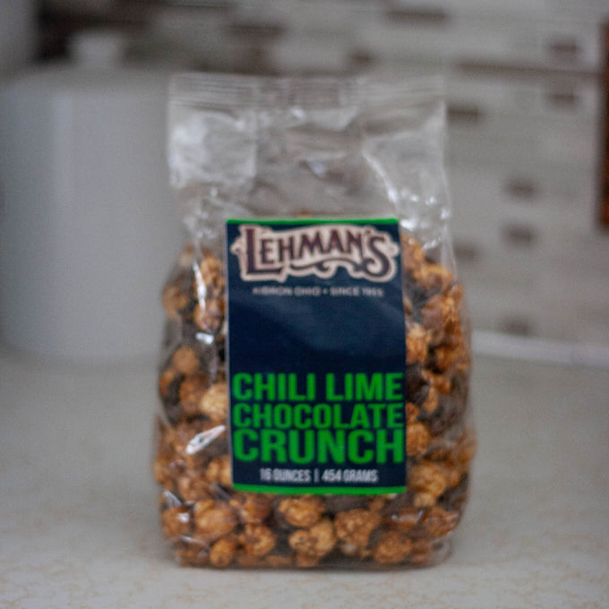 Clear bag of handcrafted chili lime chocolate popcorn crunch, a unique sweet and savory snack made in USA, perfect for Kitchen & Food, Snacks and Sweets, Popcorn, USA Made, and Best Sellers collections.