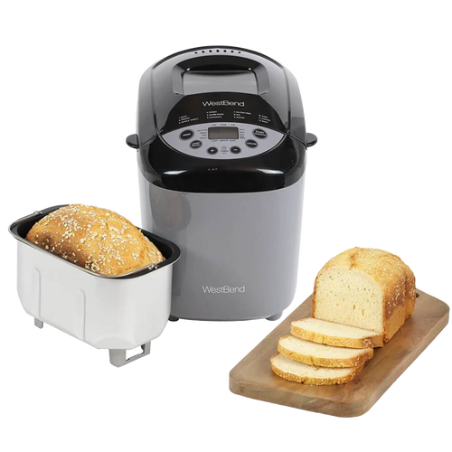 Electric bread maker machine in gray and black with digital control panel and removable baking pan alongside freshly baked loaf on wooden cutting board, featured in Kitchen & Food, Baking Supplies, and Kitchen Gadgets collections.