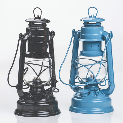 Handcrafted galvanized oil lanterns in black and blue with thermal heat-resistant SUPRAX globes, designed for reliable outdoor, camping, and emergency lighting in lamps & lighting collections.